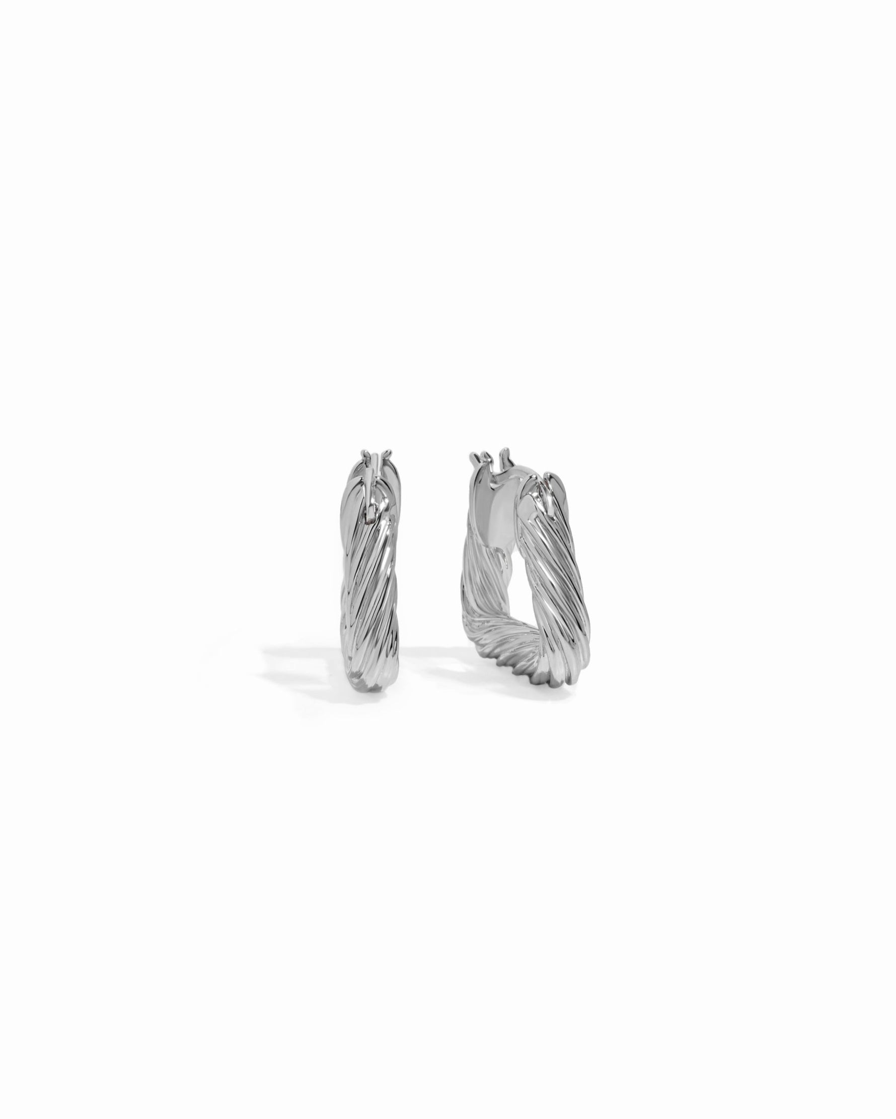 Minimalist hoop earrings  in silver.