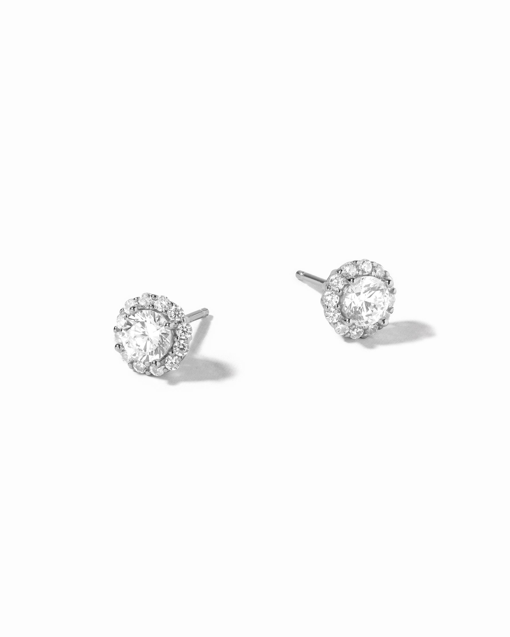 Sterling silver diamond earrings on a white background