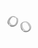 Pair of silver hoop earrings on a white background