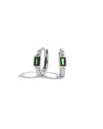 sterling silver cubic zirconia huggie hoops with an emerald green baguette stone in the center
