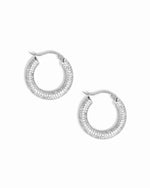 Silver hoop earring with small pave cubic zirconia diamonds on a white background 