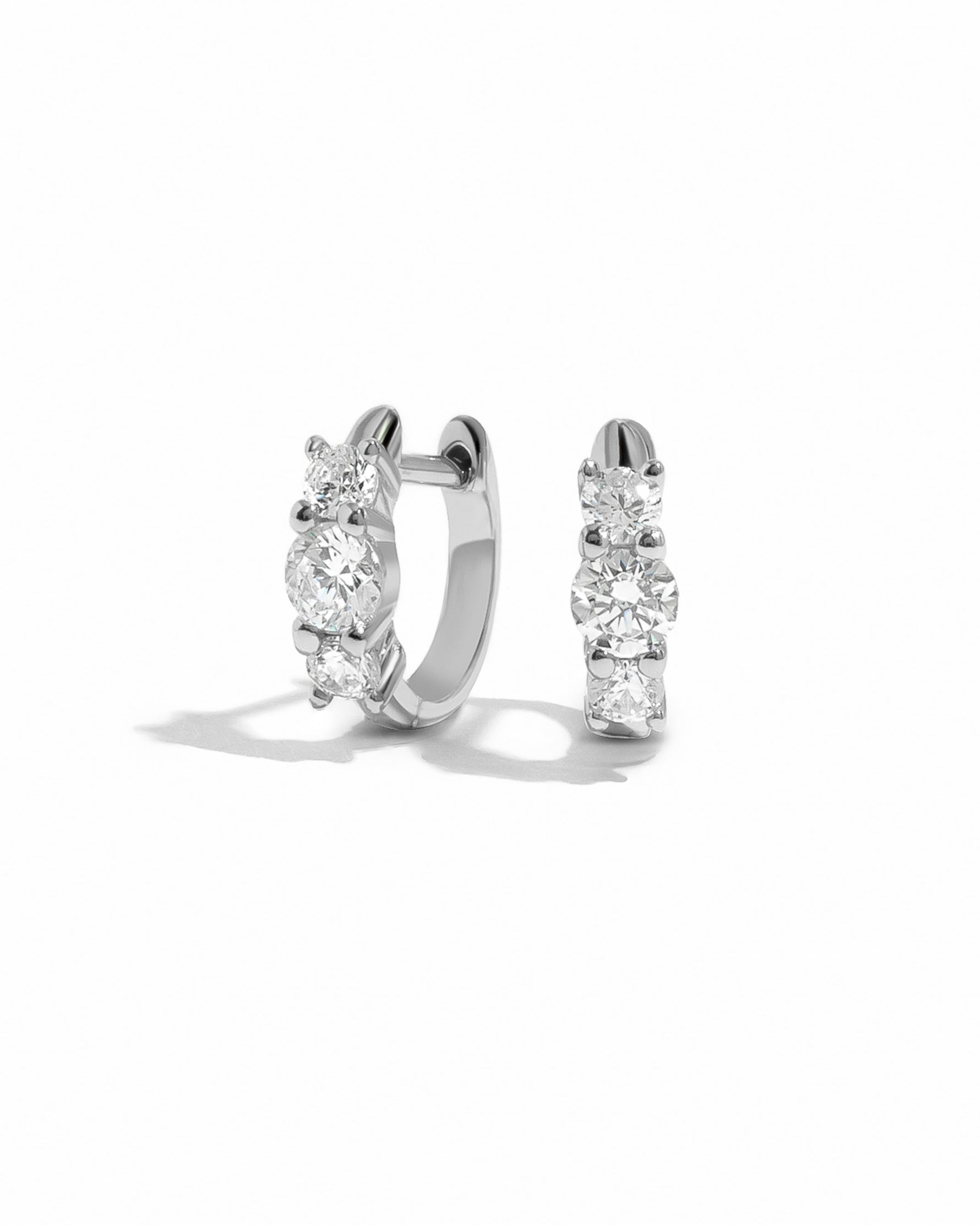 silver huggie earrings with cubic zirconia stones