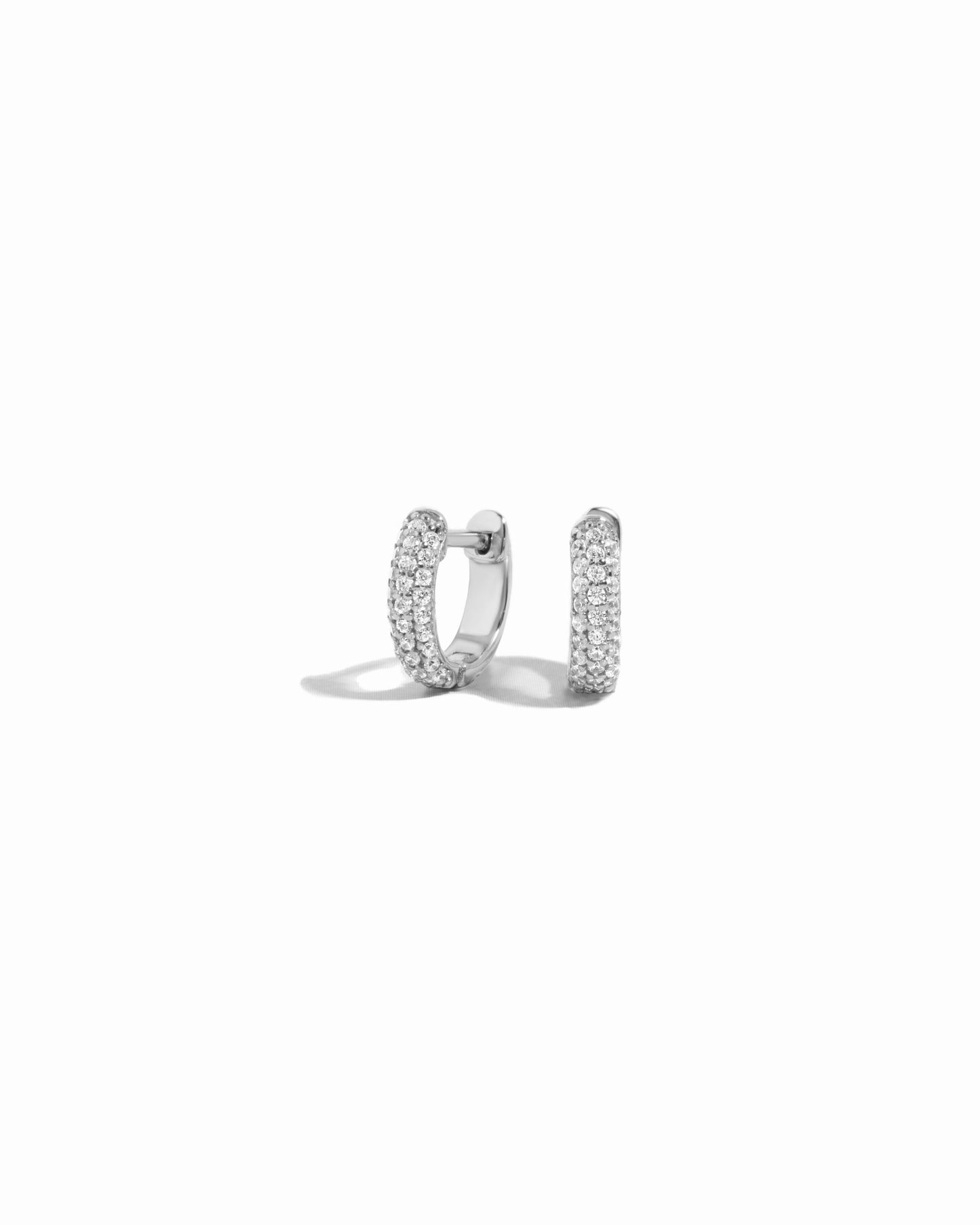 dainty small hoop earring featuring silver cubic zirconia stones 