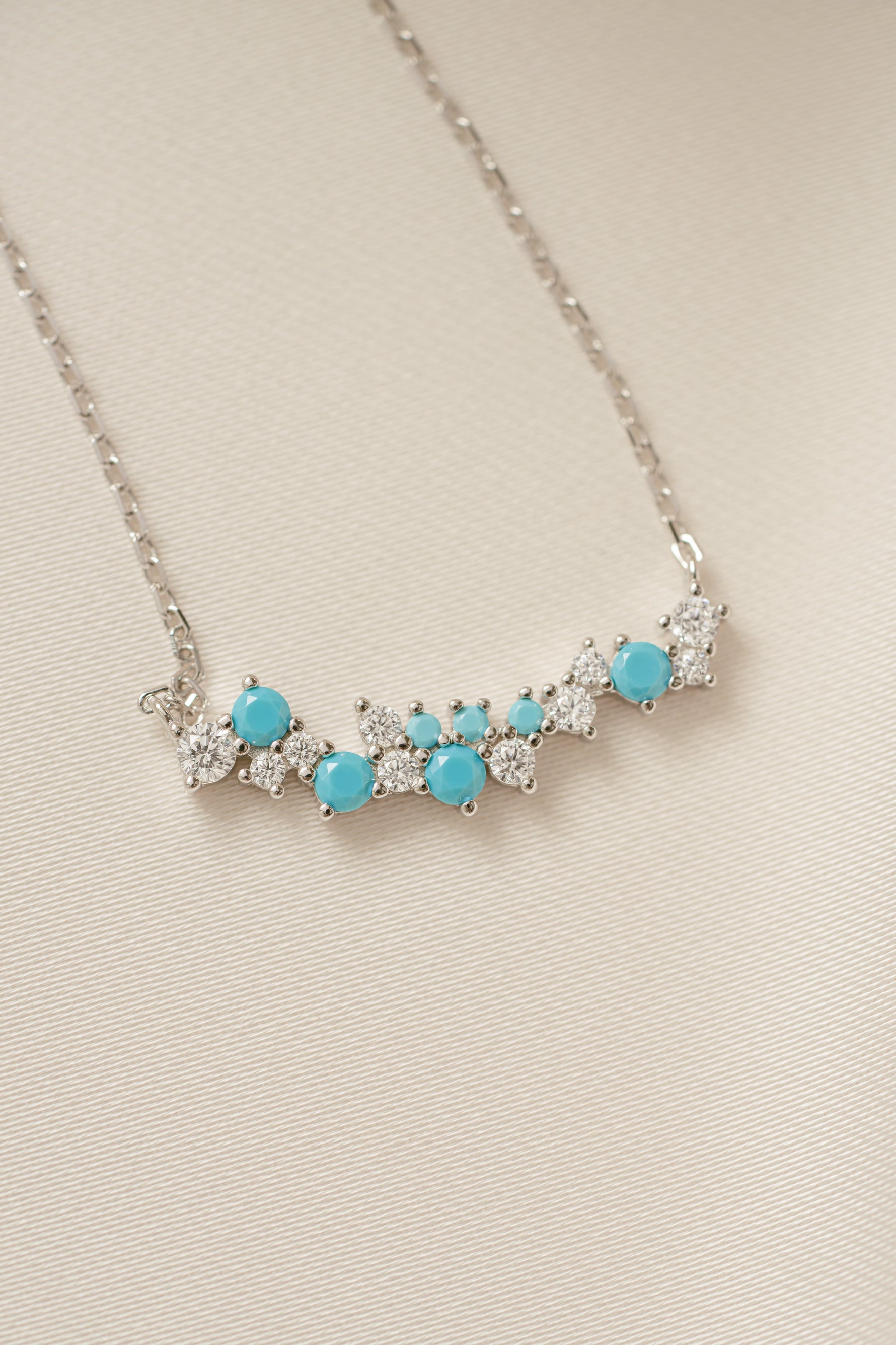 boho necklace with a beaded necklace design with turquoise stones on a beige background