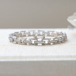 Closeup image of silver bracelet with chain link cubic zirconia design