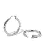 Silver madison beer lightweight hoop earrings on white background