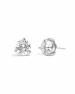 Pair of diamond stud earrings on a white background