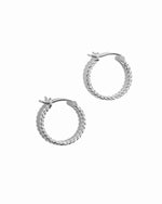 Closeup image of silver minimalist hoop earring