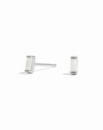 closeup of silver opal earrings 