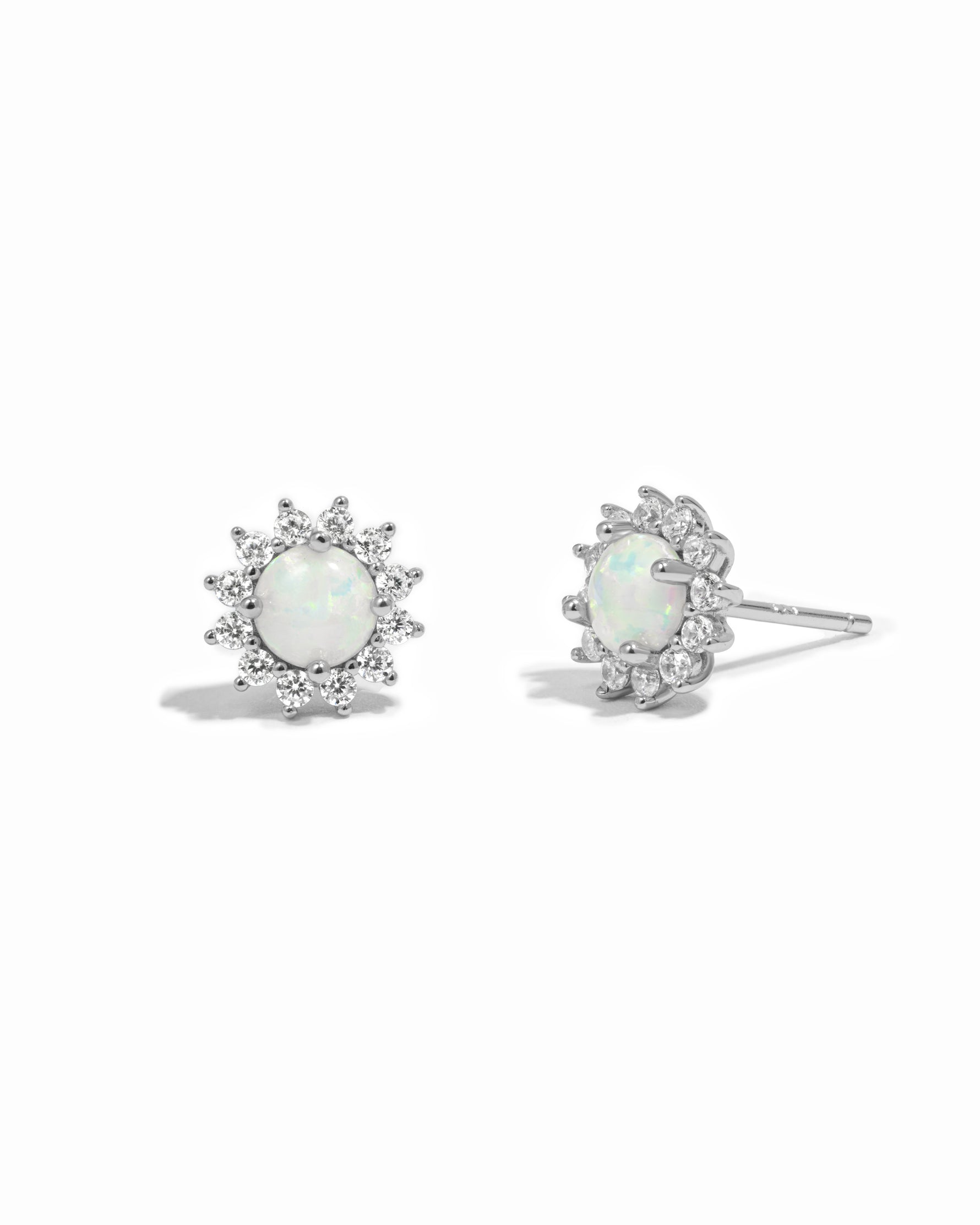 Sterling silver opal stud earrings with diamond halo.
