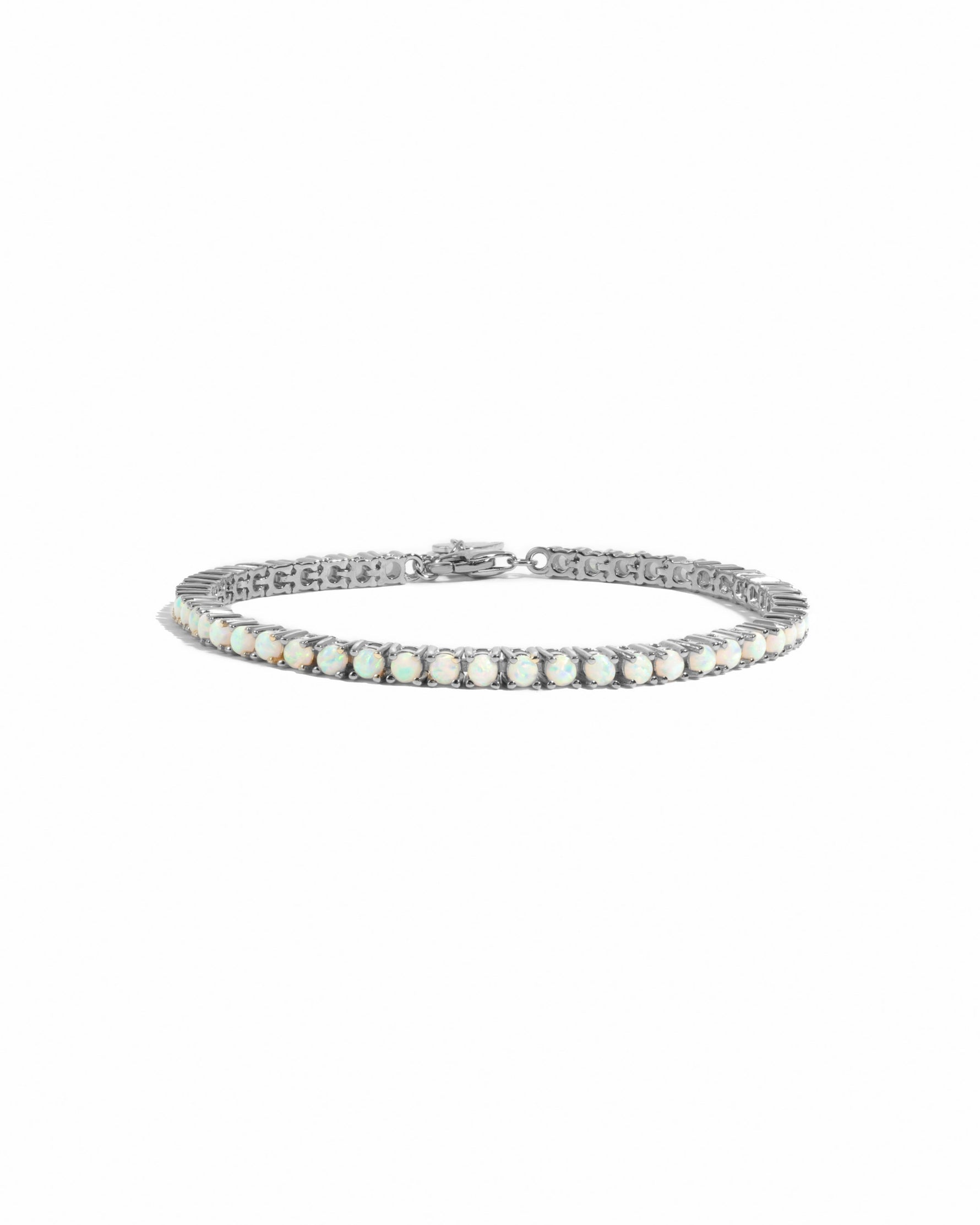 Silver opal tennis bracelet on a white background