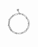 Silver paperclip chain bracelet on a white background 