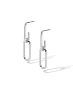 Silver paperclip hoop earrings on a white background