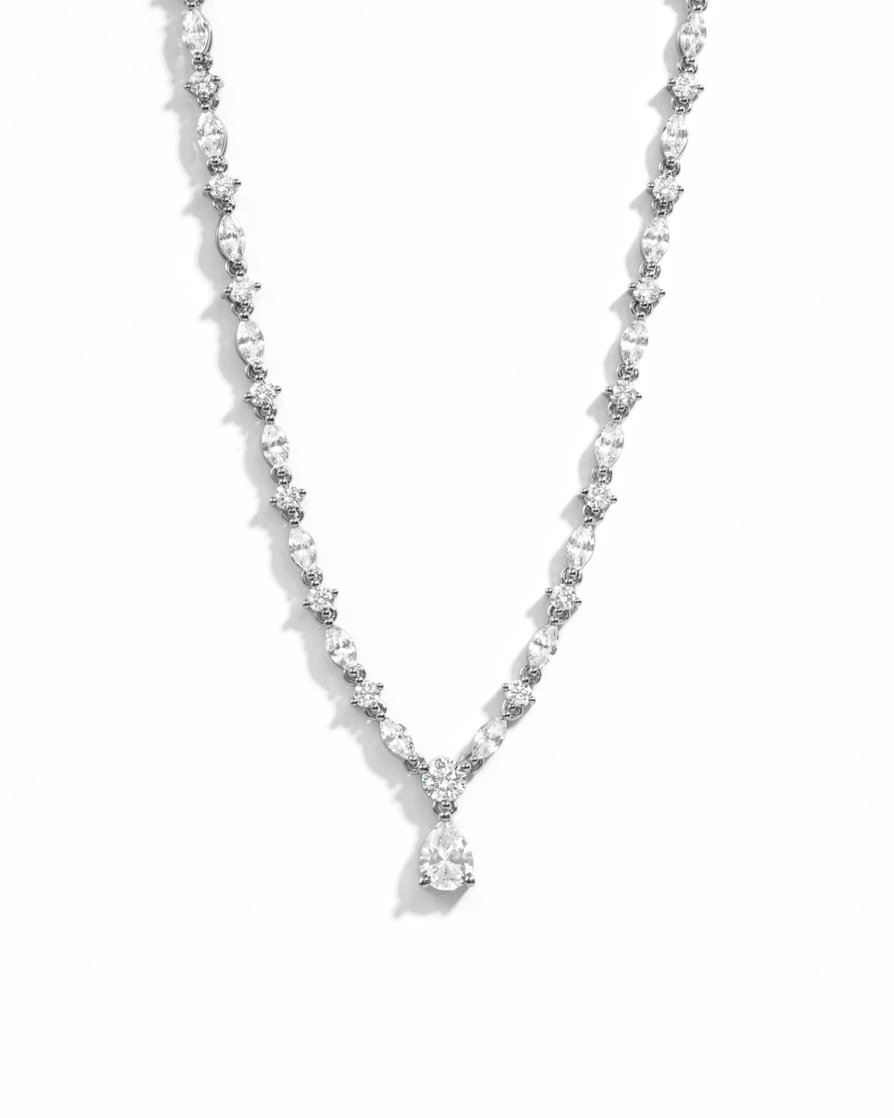 Silver diamond necklace on white background