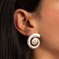 model wearing drop earring featuring silver swirl earrings 