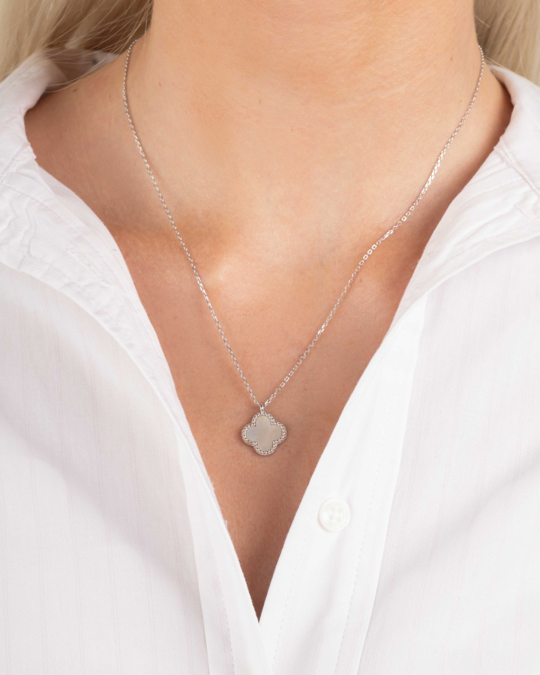 model wearing sterling silver clover pendant necklace
