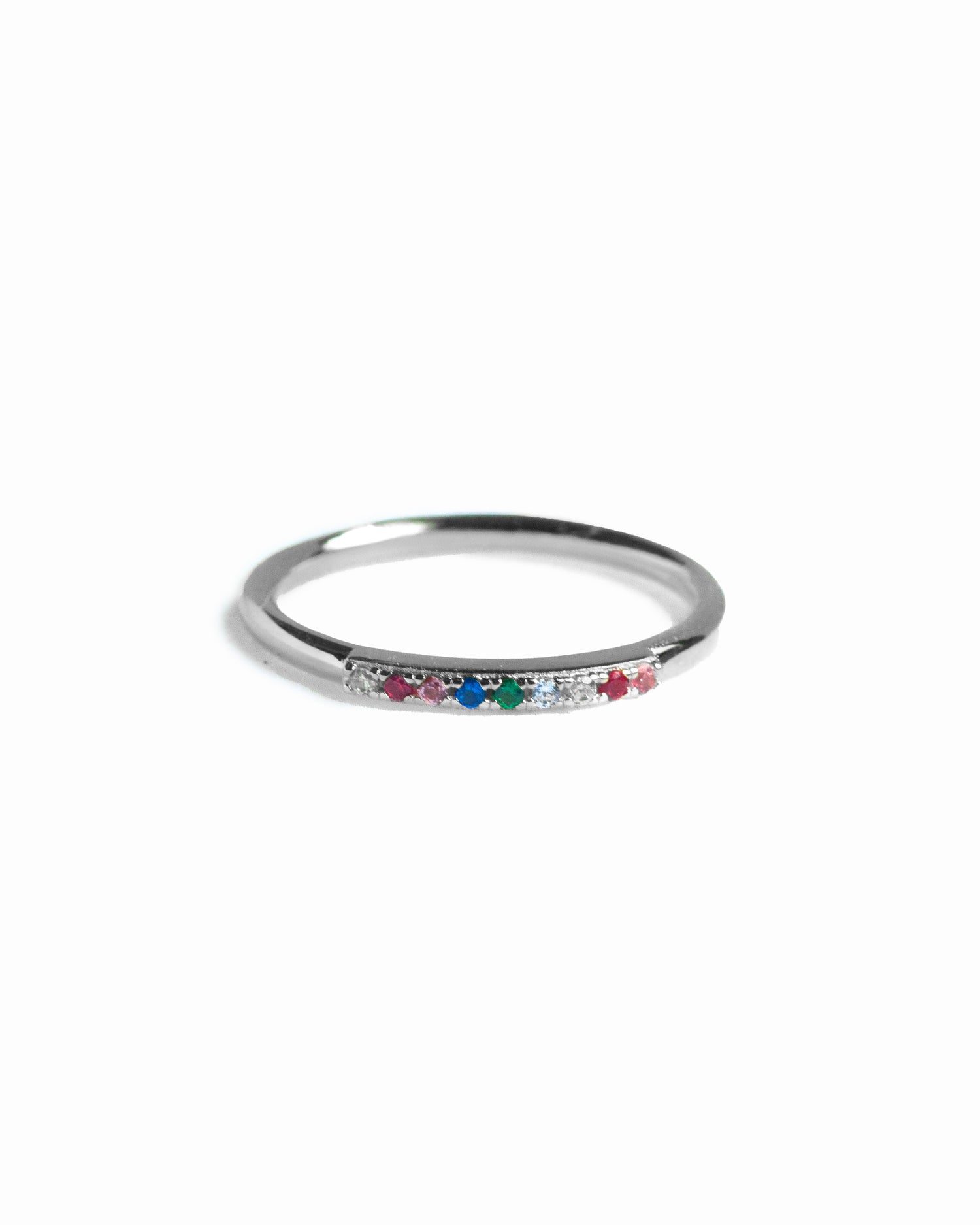 Silver ring with colorful gemstones on a white background