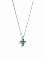 Silver chain dainty cross necklace on white background