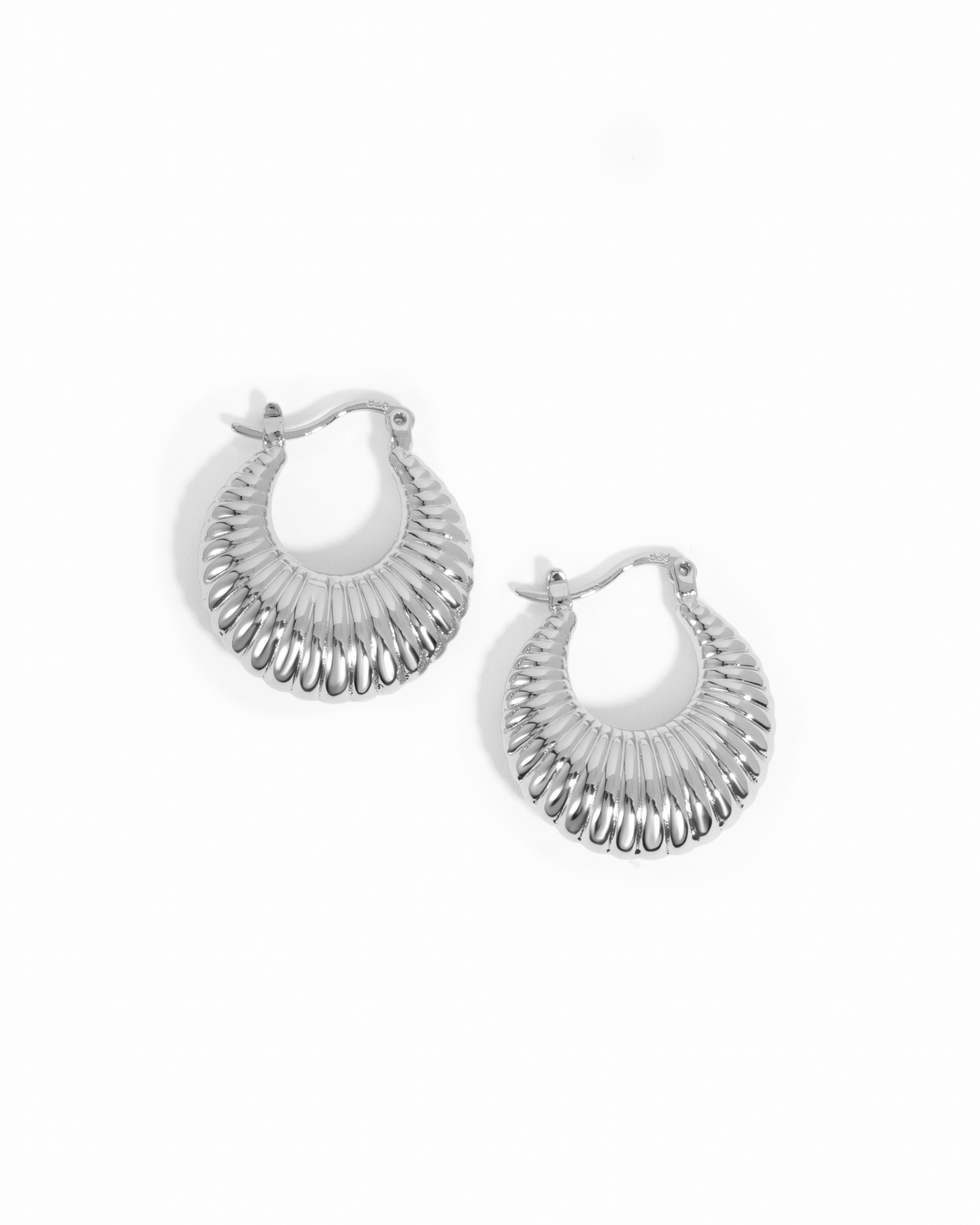 Silver hoop earrings on a white background
