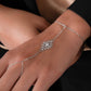 closeup image of model wearing silver hand chain bracelet 