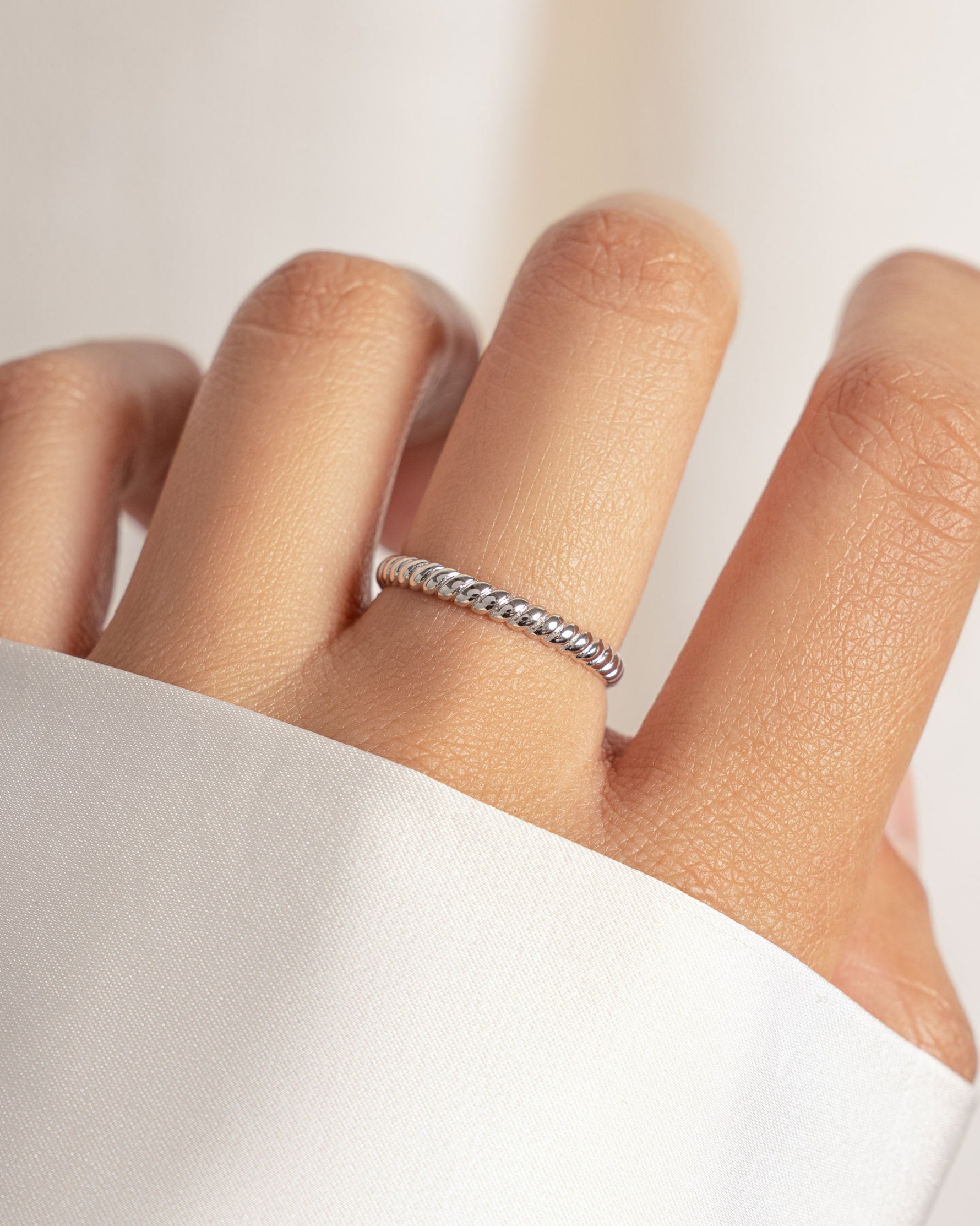 model wearing silver rope ring