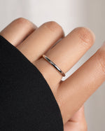 Hand wearing a silver ring on a model