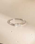 sterling silver dainty stacking ring with baguette stone