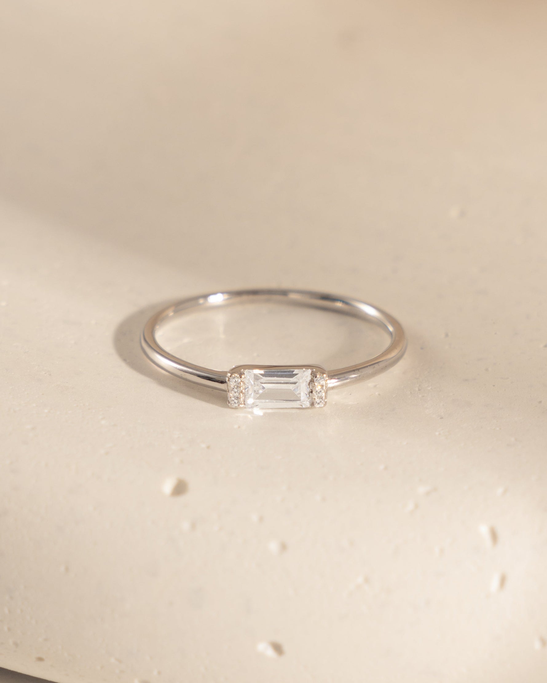 sterling silver dainty stacking ring with baguette stone