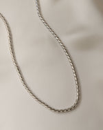 sterling silver statement necklace on a silk background