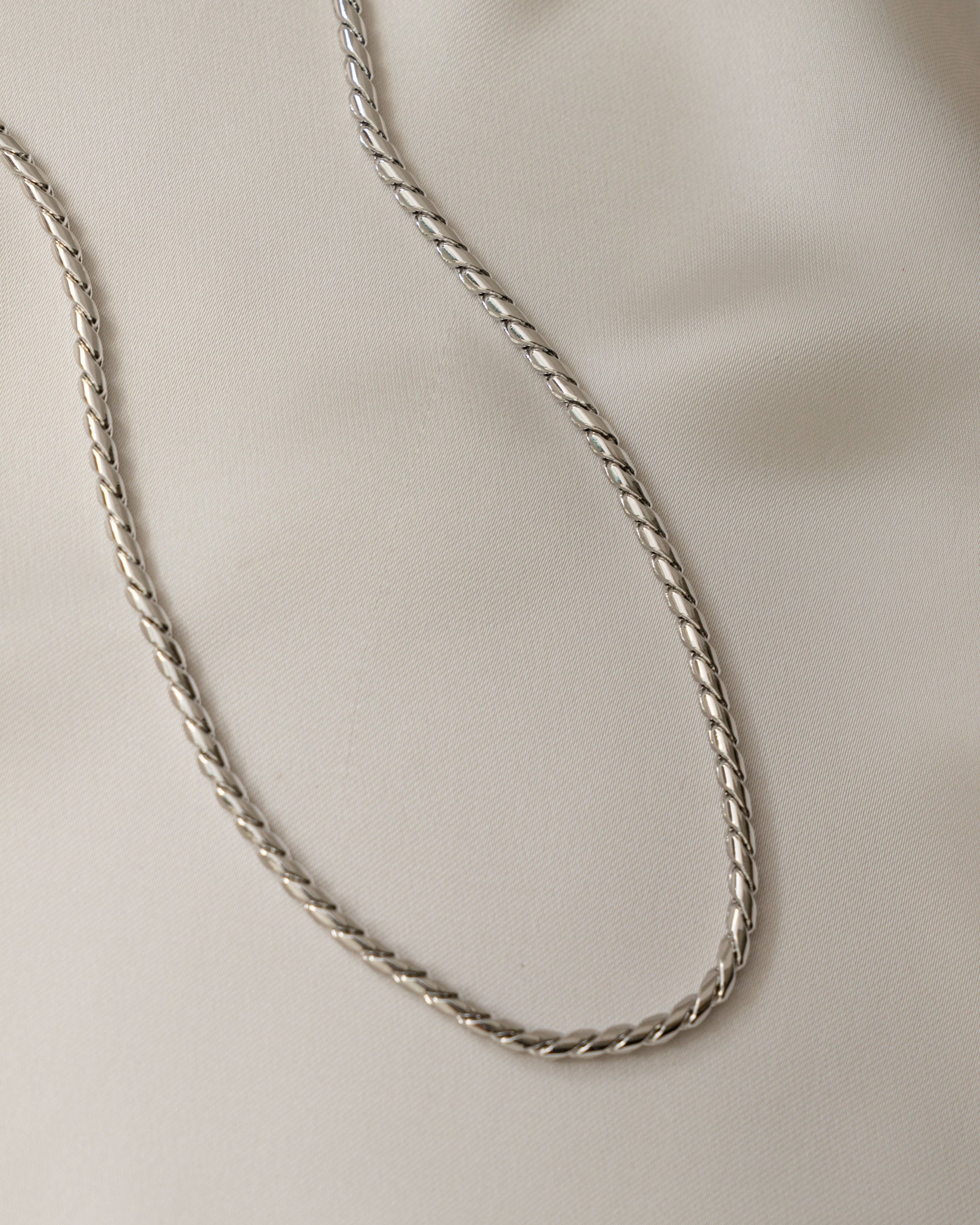 sterling silver statement necklace on a silk background