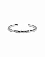 Silver statement cuff bracelet on a white background