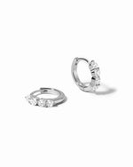 Pair of sterling silver mini hoops on a white background