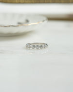 Sterling silver vintage ring with small bezel set diamonds