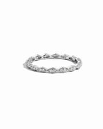 Closeup image of dainty sterling silver diamond ring