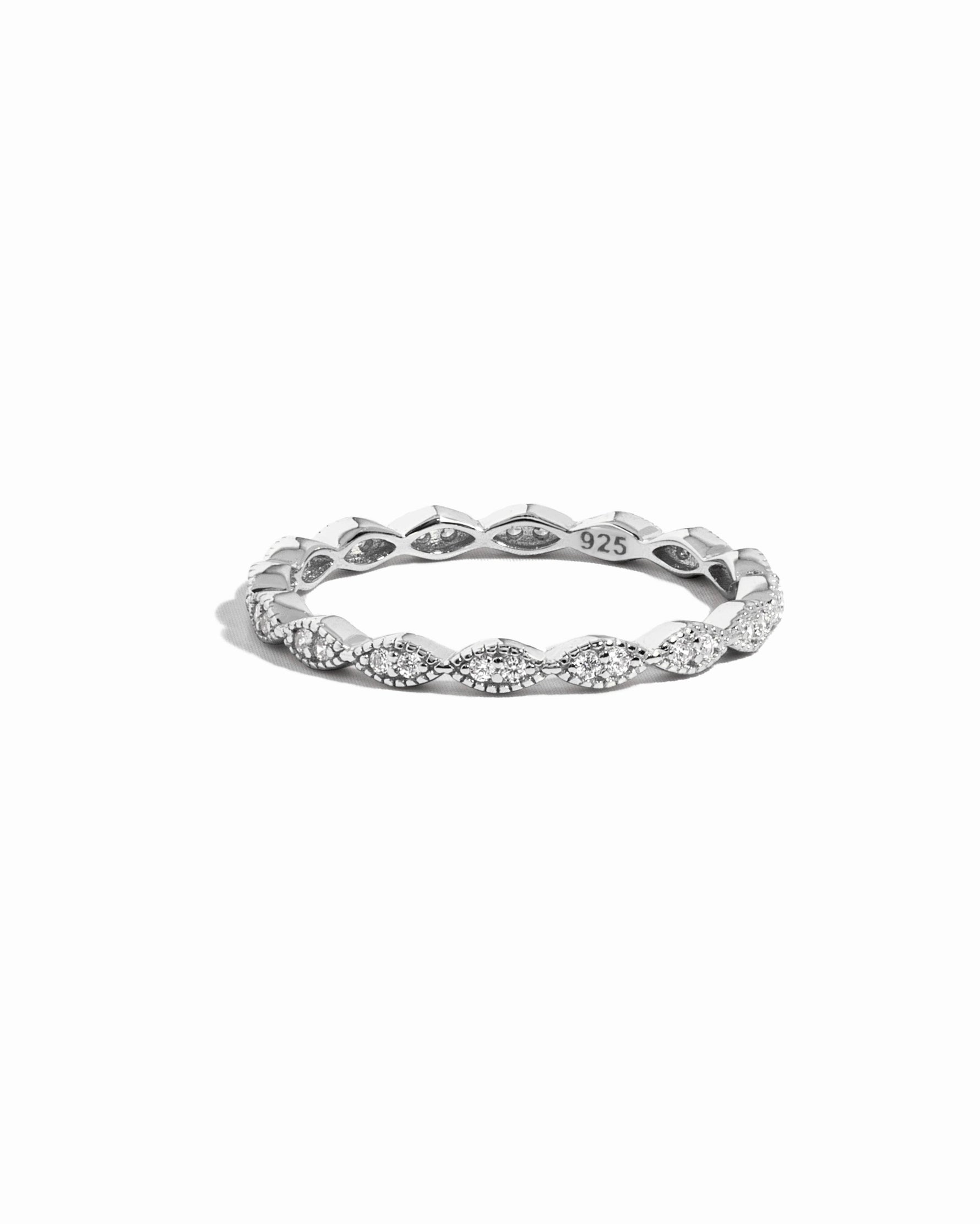 Closeup image of dainty sterling silver diamond ring