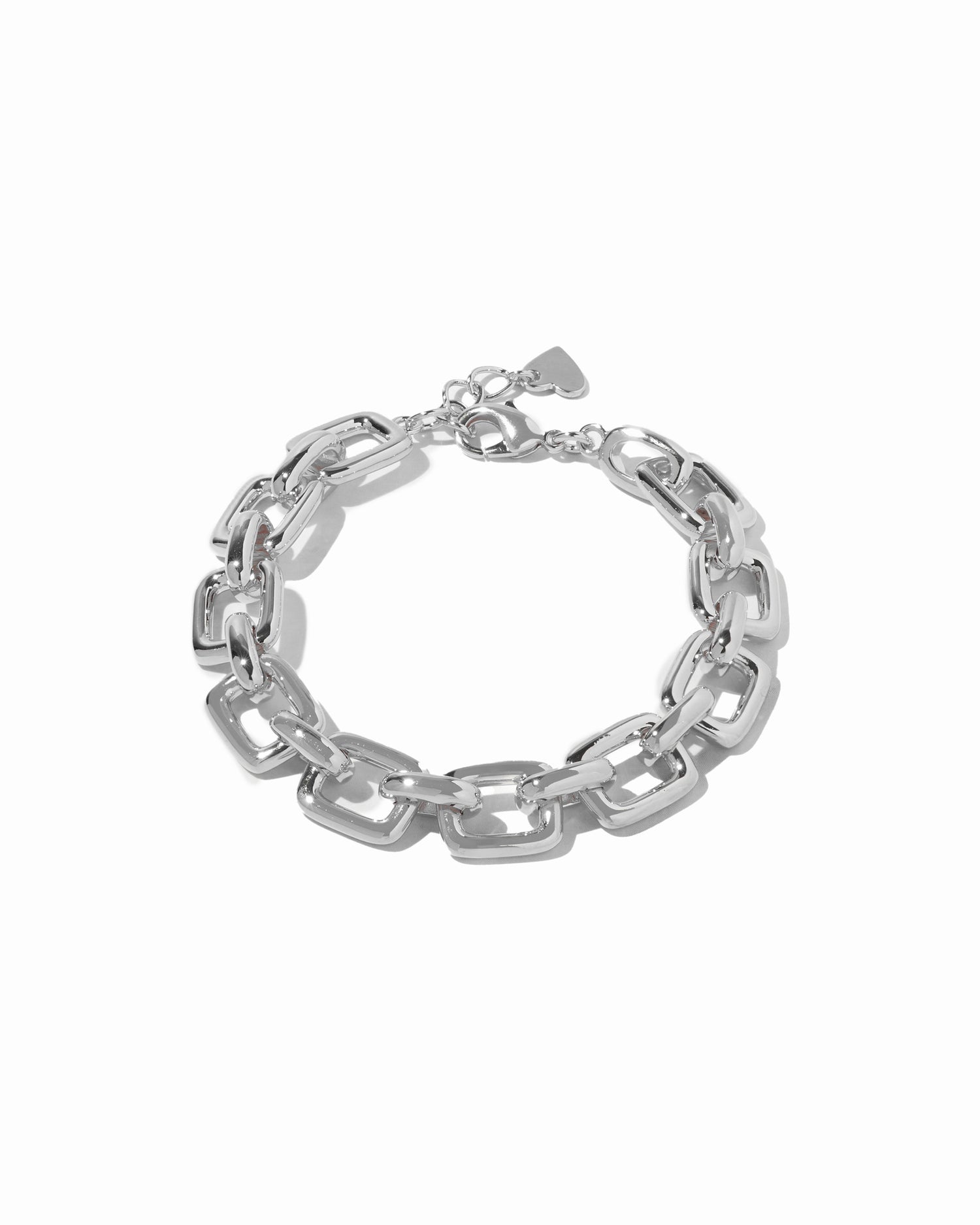 Silver chain statement bracelet on a white background