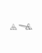 Pair of silver  triangle-shaped 3 stone stud earrings on a white background