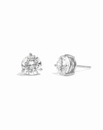 Silver diamond earrings on a white background