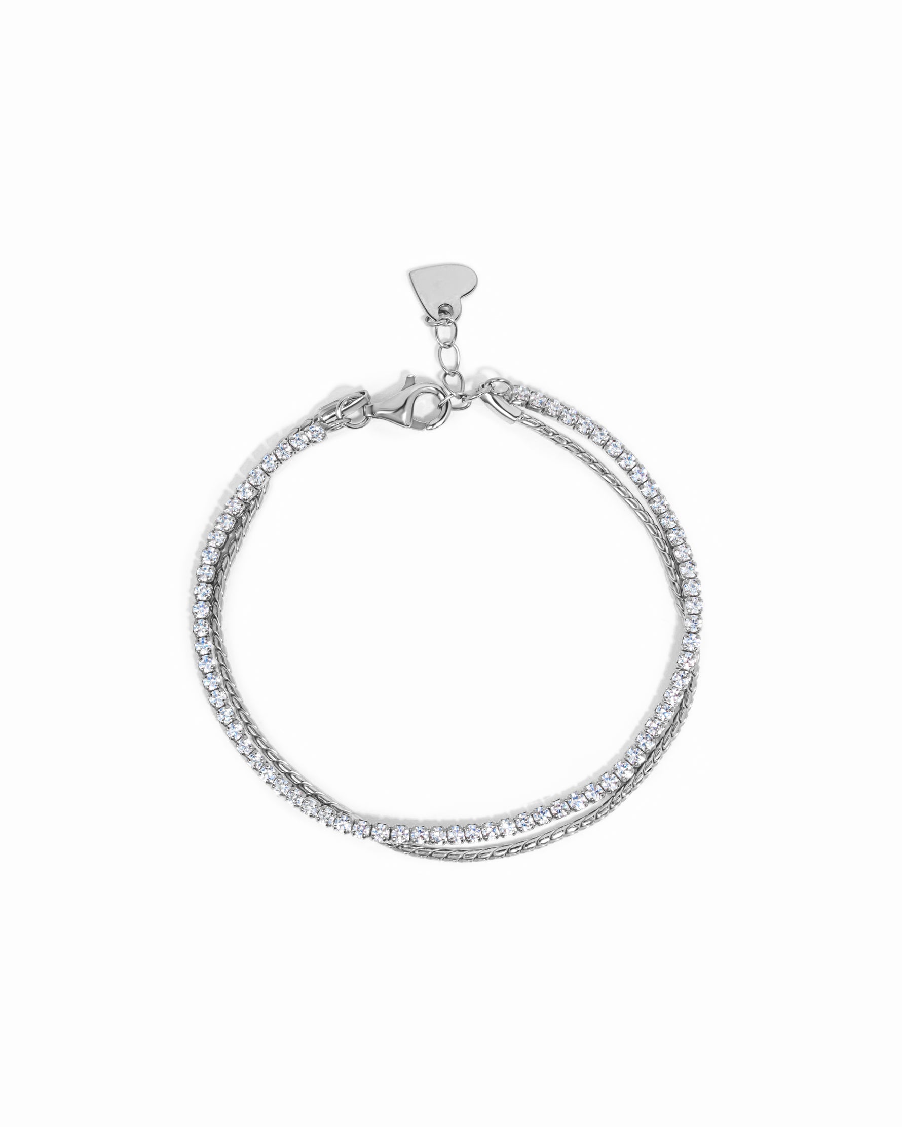 Sterling silver bracelet set with a diamond tennis bracelet and rope chain bracelet on a white background