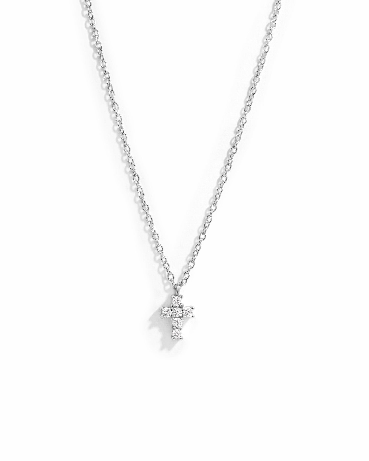 small pendant necklace with tiny cross pendant in sterling silver
