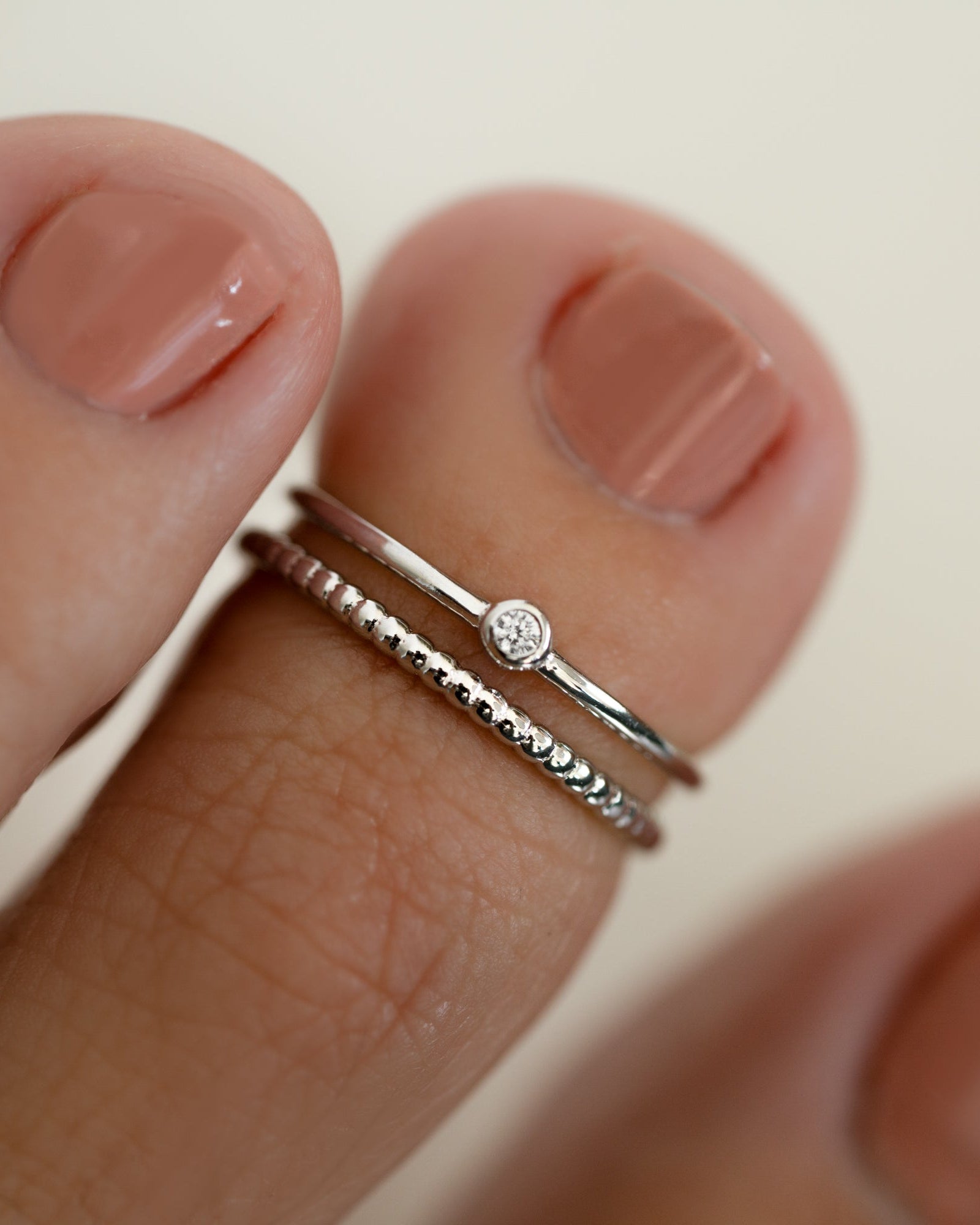 Sterling silver dainty boho toe ring on model