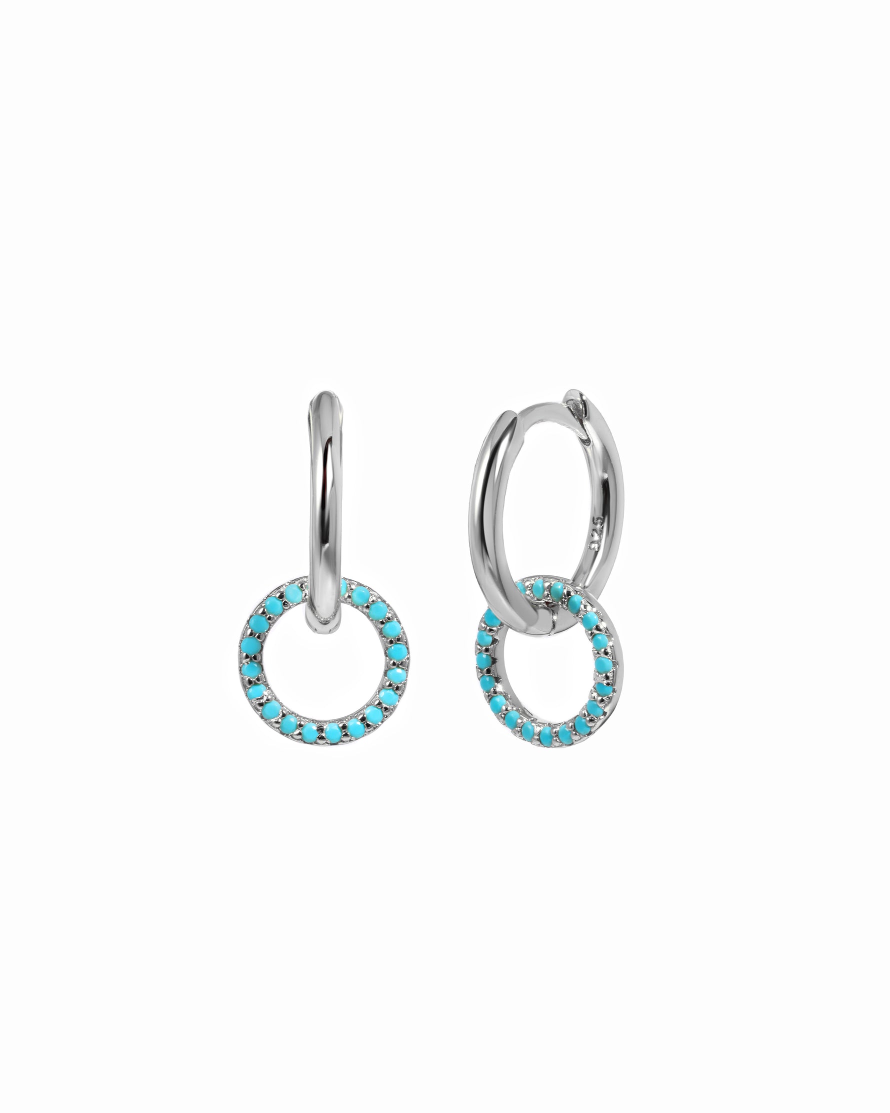 Silver hoop earrings with turquoise stones on a white background