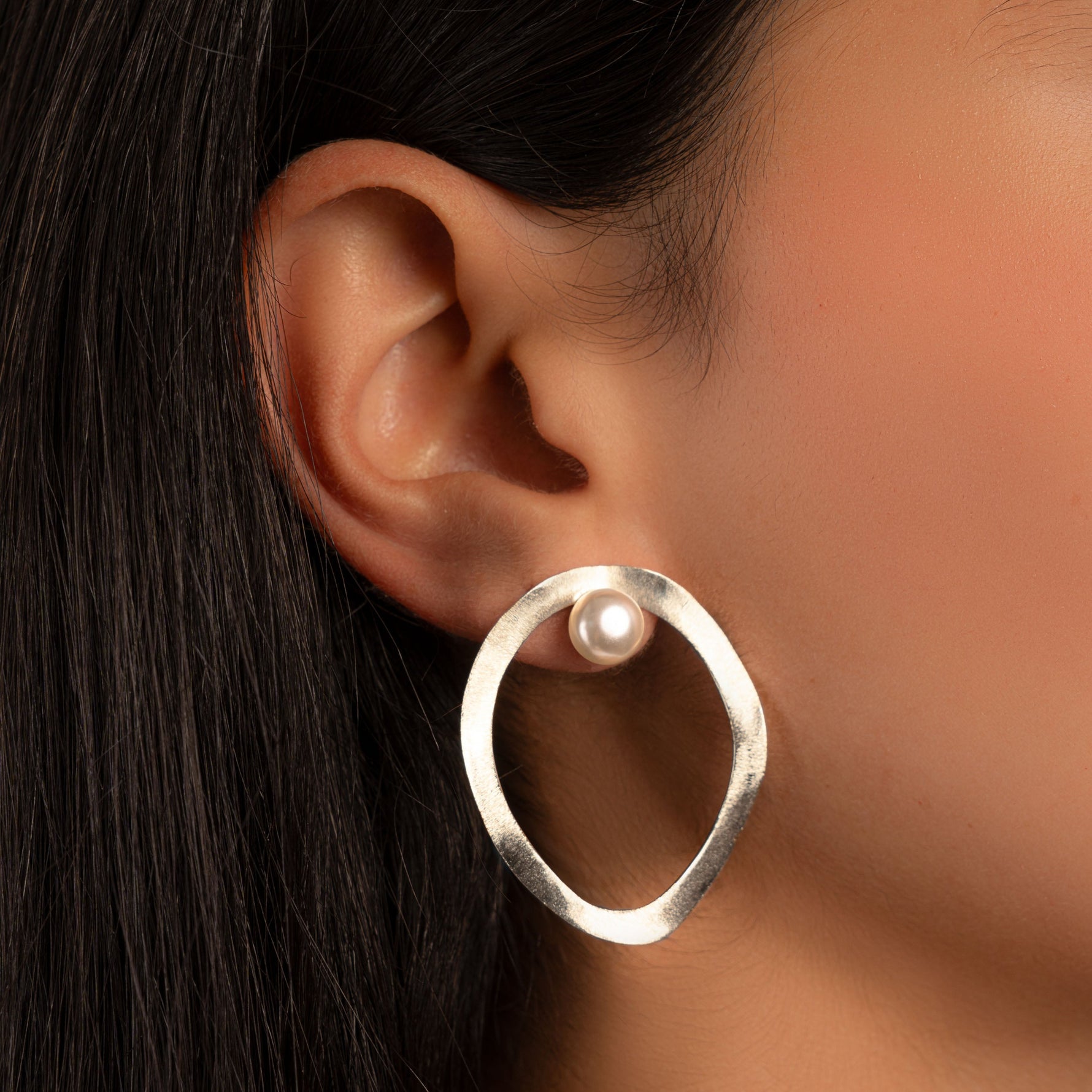 model wearing boho earrings featuring a freshwater pearl