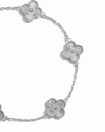 closeup image of intricate clover design on silver chain bracelet