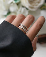 model wearing sterling silver double band ring with pave diamonds going from the top to the bottom of the ring