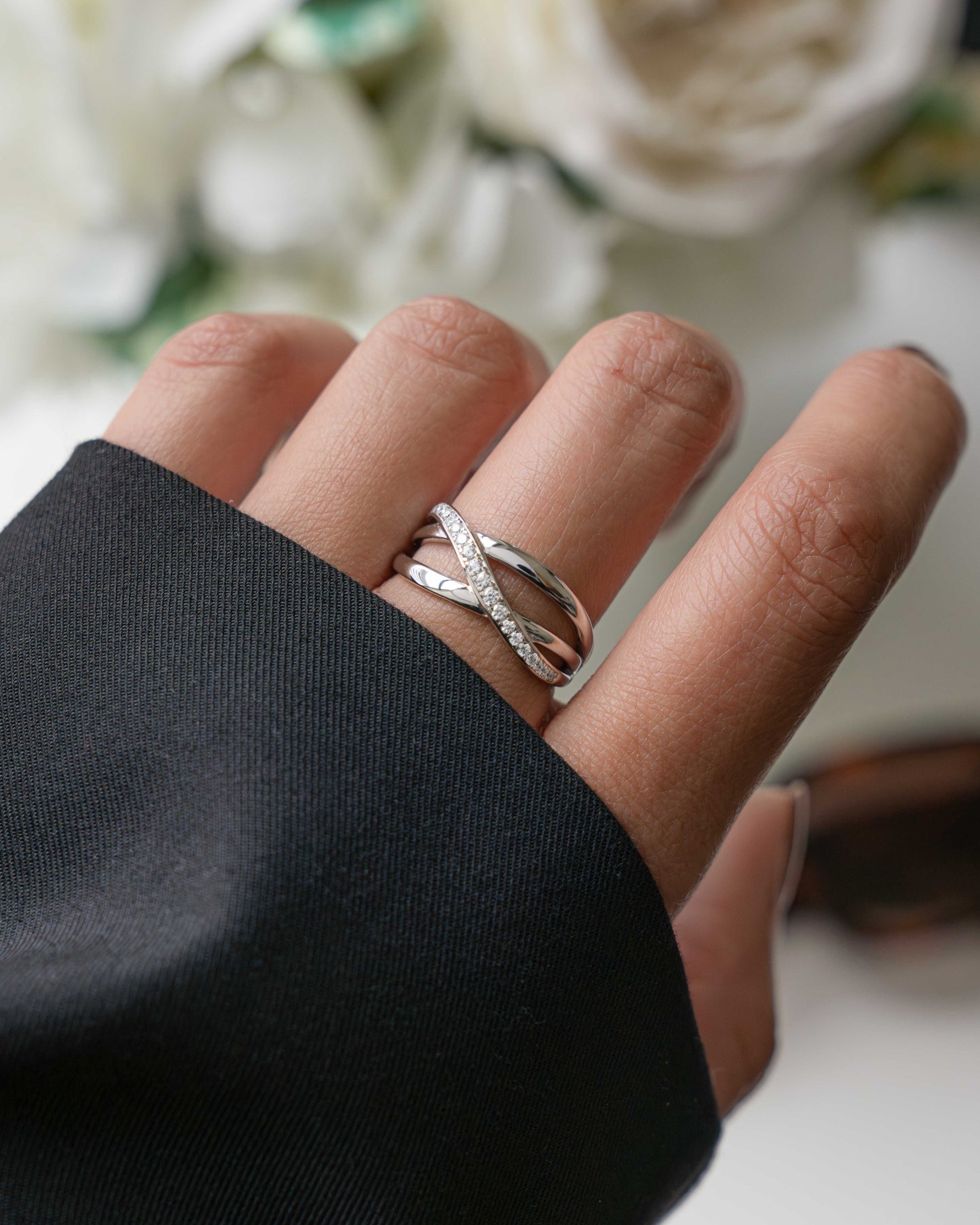 model wearing sterling silver double band ring with pave diamonds going from the top to the bottom of the ring
