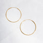 closeup image of dainty hoop earrings