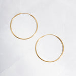 closeup image of dainty hoop earrings