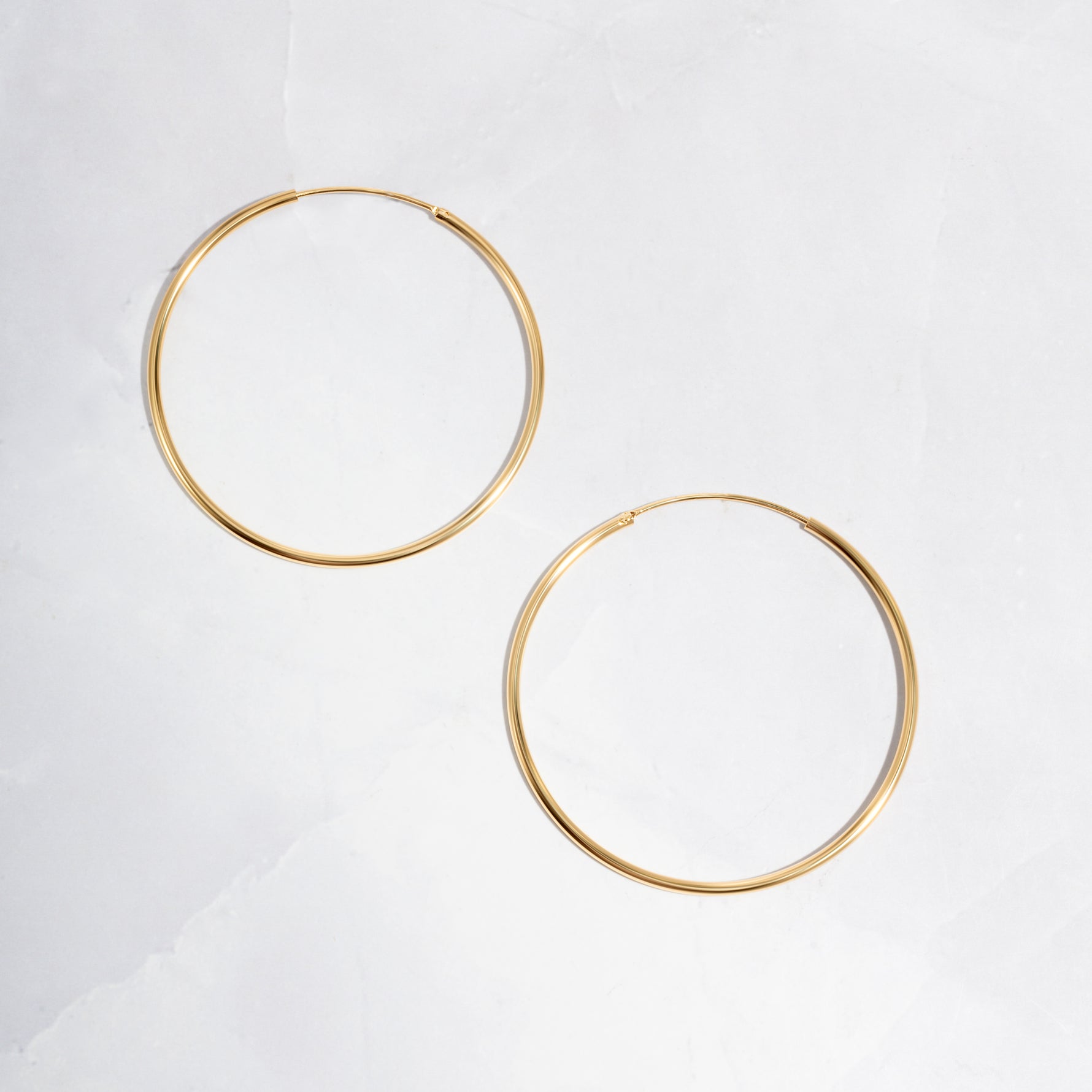 closeup image of dainty hoop earrings