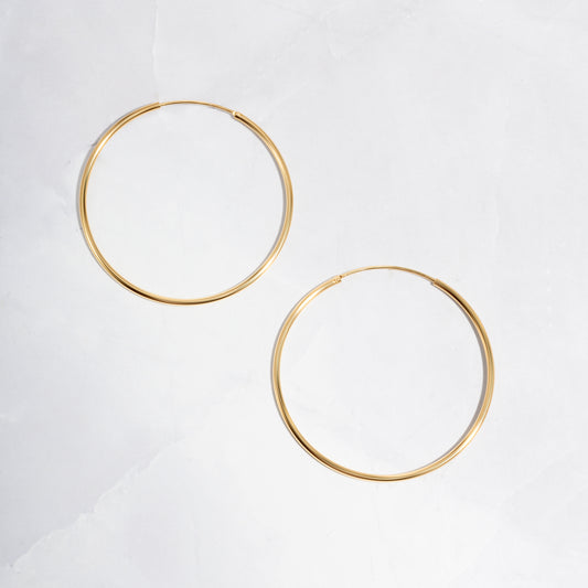 closeup image of dainty hoop earrings
